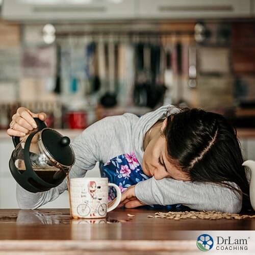 An image of a fatigued woman pouring coffee onto the table instead of in her cup