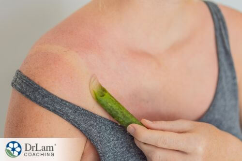 An image of a woman applying aloe vera into her skin