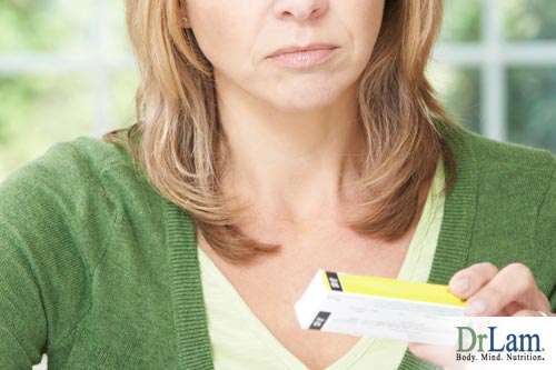 A woman looking at medication for adrenal fatigue/